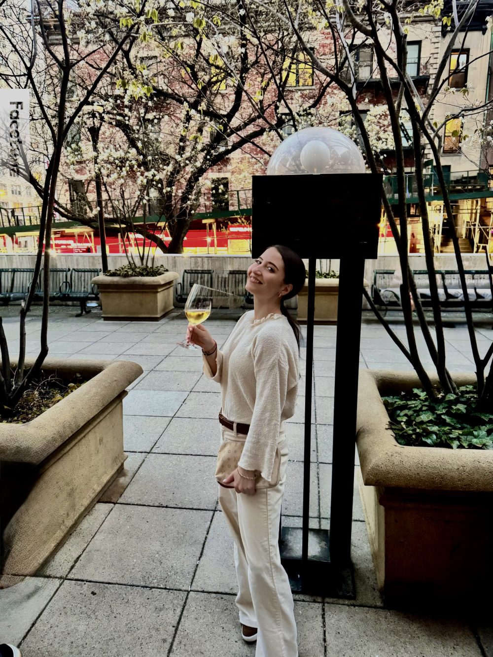 nyc influencer with an all white spring outfit at the consulate murray hill